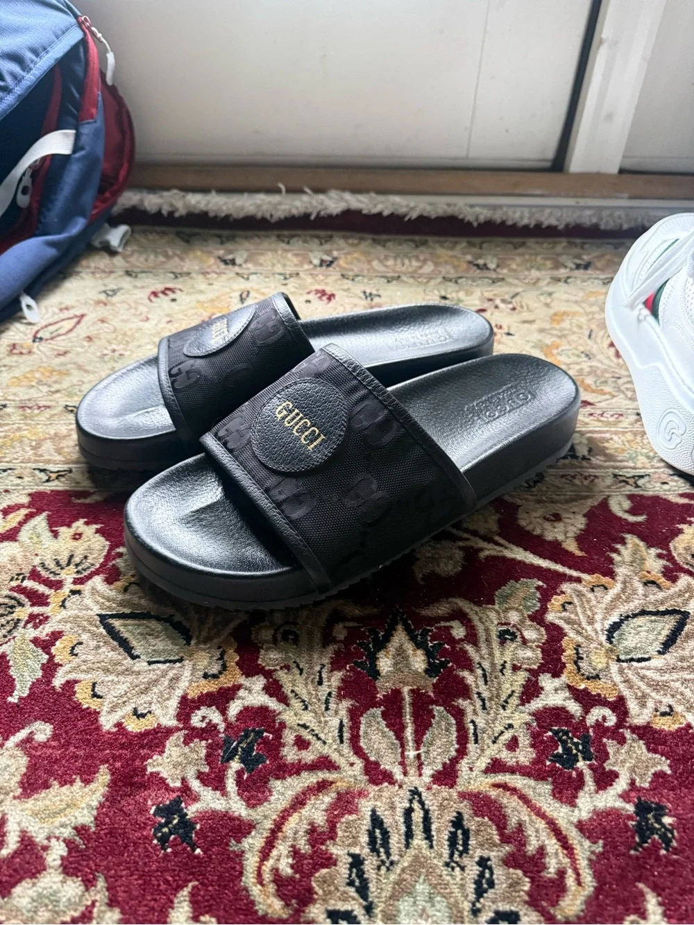 Gucci Black GG Monogram Slide Sandals with Gold Logo